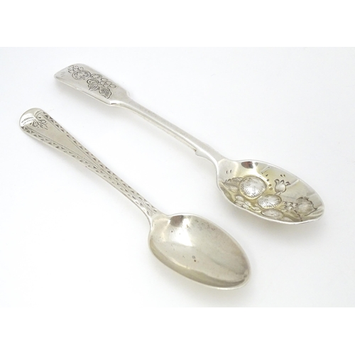 405 - Two silver teaspoons, one Victorian example with bright cut decoration hallmarked London 1877, maker... 