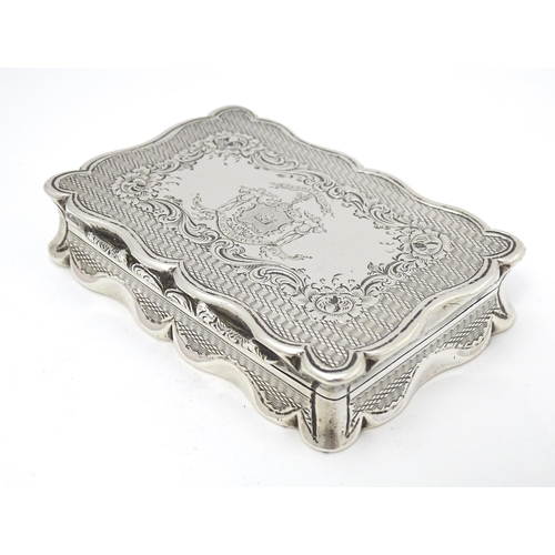 406 - A Victorian silver table snuff box with engine turned decoration and engraved crest to lid opening t... 