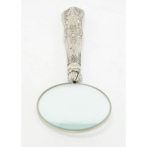 409 - A silver handled magnifying glass.  Approx. 6 1/4