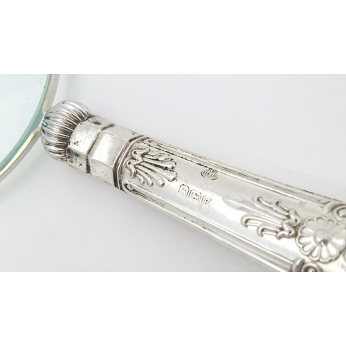 409 - A silver handled magnifying glass.  Approx. 6 1/4