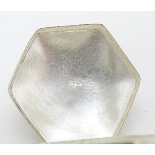 411 - A .925 silver pill box of hexagonal form with engraved decoration. Approx. 1 1/4