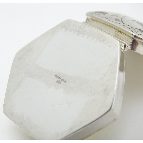 411 - A .925 silver pill box of hexagonal form with engraved decoration. Approx. 1 1/4