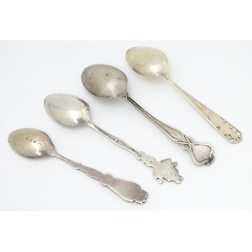 416 - Four silver souvenir spoons to include one hallmarked Birmingham 1932  titled St Dunstan's to handle... 