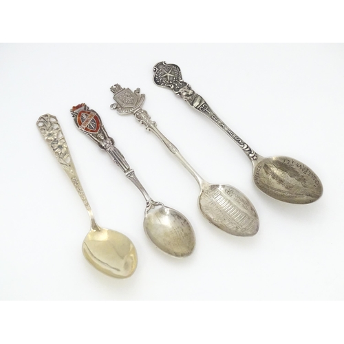 416 - Four silver souvenir spoons to include one hallmarked Birmingham 1932  titled St Dunstan's to handle... 