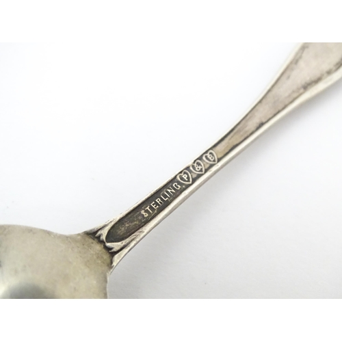 416 - Four silver souvenir spoons to include one hallmarked Birmingham 1932  titled St Dunstan's to handle... 