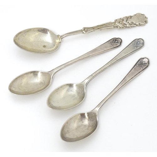 417 - Three silver teaspoons with crossed golf club decoration to handles hallmarked Sheffield 1933 maker ... 