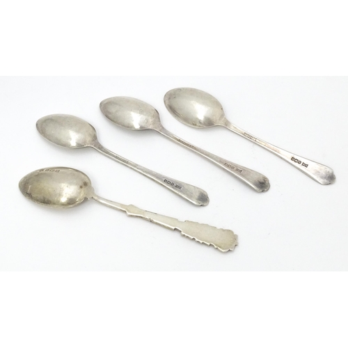 417 - Three silver teaspoons with crossed golf club decoration to handles hallmarked Sheffield 1933 maker ... 