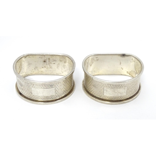 430 - Two silver napkin rings with engine turned decoration. Hallmarked Birmingham 1959/60 maker W I Broad... 