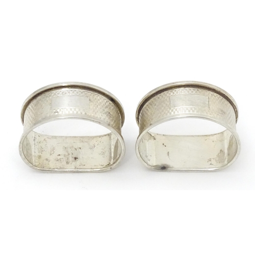 430 - Two silver napkin rings with engine turned decoration. Hallmarked Birmingham 1959/60 maker W I Broad... 