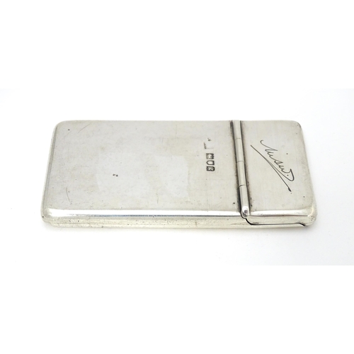 432 - A silver card case with sprung lid and gilded interior. Hallmarked London 1902 maker Samson Mordan &... 
