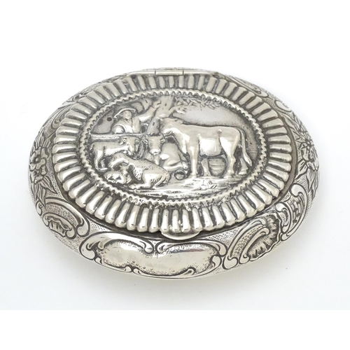 433 - A Dutch silver snuff box / tobacco box of ovoid form, the lid decorated with pastoral scene with fig... 