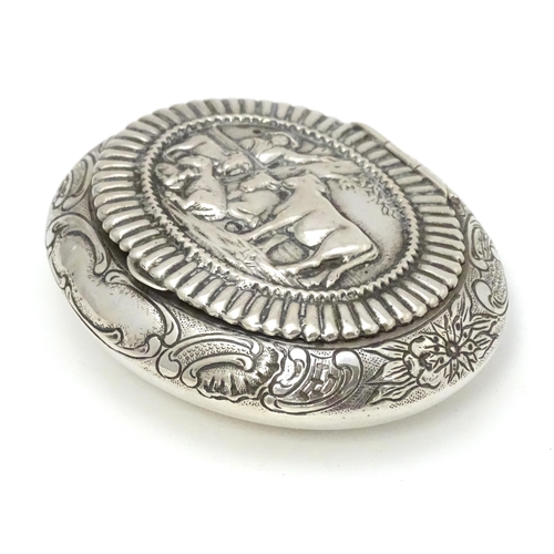 433 - A Dutch silver snuff box / tobacco box of ovoid form, the lid decorated with pastoral scene with fig... 