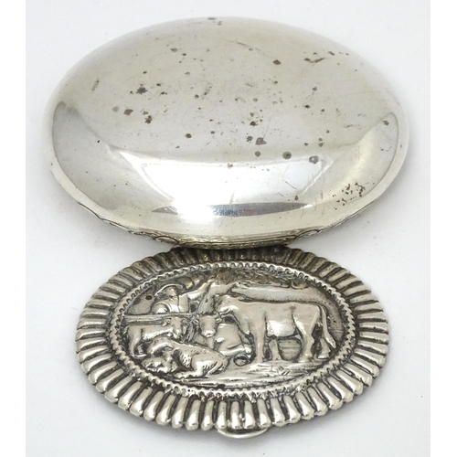 433 - A Dutch silver snuff box / tobacco box of ovoid form, the lid decorated with pastoral scene with fig... 