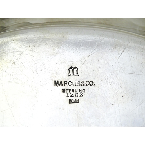 440 - An American sterling silver salver / tray by Marcus & Co. Marked under. Approx. 12