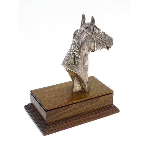 441 - A filled silver horse head trophy, hallmarked Sheffield 1999, maker Camelot Silverware Ltd. on a woo... 