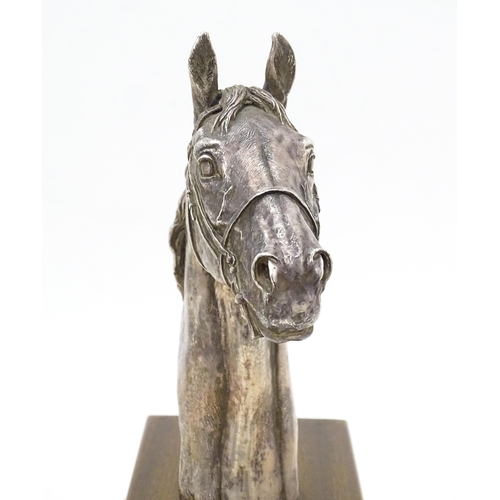 441 - A filled silver horse head trophy, hallmarked Sheffield 1999, maker Camelot Silverware Ltd. on a woo... 