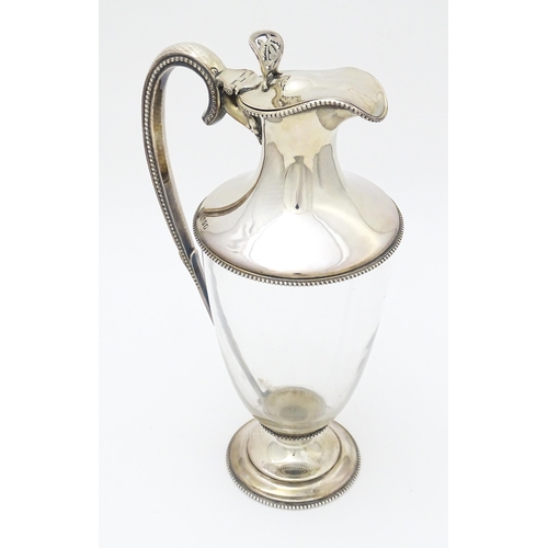 442 - A Victorian glass claret jug with silver mounts and handle, hallmarked Sheffield 1873, maker W. & G.... 