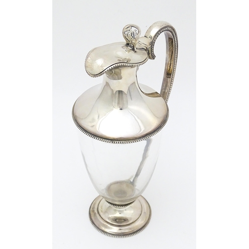 442 - A Victorian glass claret jug with silver mounts and handle, hallmarked Sheffield 1873, maker W. & G.... 