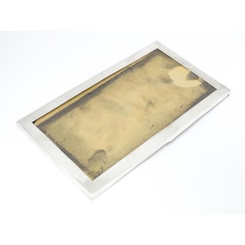 443 - A photograph frame with silver surround hallmarked Birmingham 1920. Approx. 5 3/4