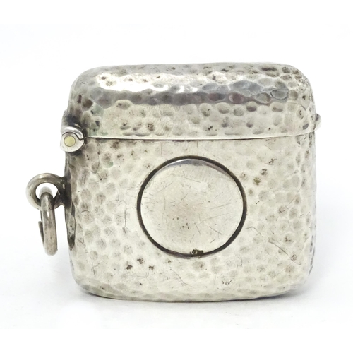 451 - A silver vesta case with hammered decoration hallmarked Birmingham 1906, maker Cornelius Desormeaux ... 