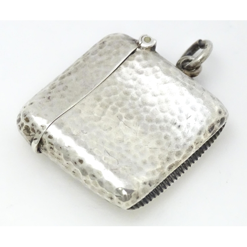 451 - A silver vesta case with hammered decoration hallmarked Birmingham 1906, maker Cornelius Desormeaux ... 