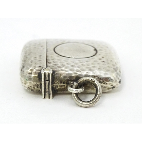 451 - A silver vesta case with hammered decoration hallmarked Birmingham 1906, maker Cornelius Desormeaux ... 