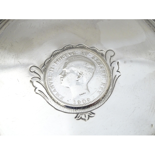 453 - A Portuguese silver dish with inset coin decoration dated 1909. Approx. 4