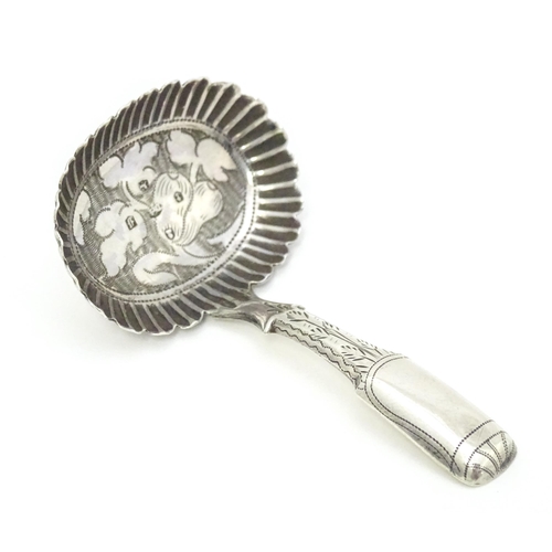 456 - A Geo IV silver caddy spoon with foliate decoration, hallmarked Birmingham 1829. Approx. 2 3/4