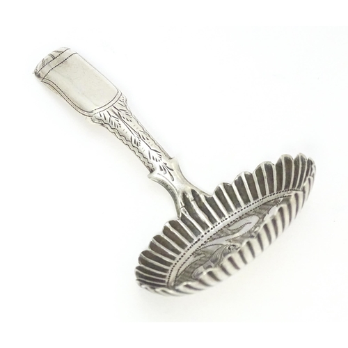 456 - A Geo IV silver caddy spoon with foliate decoration, hallmarked Birmingham 1829. Approx. 2 3/4