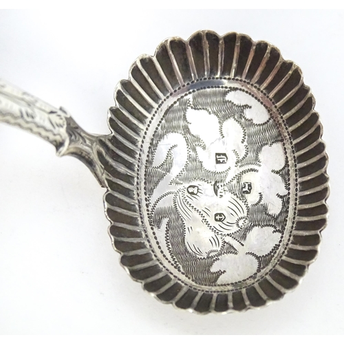 456 - A Geo IV silver caddy spoon with foliate decoration, hallmarked Birmingham 1829. Approx. 2 3/4