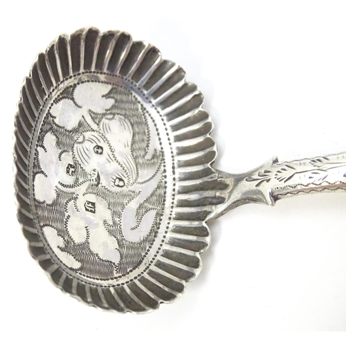 456 - A Geo IV silver caddy spoon with foliate decoration, hallmarked Birmingham 1829. Approx. 2 3/4