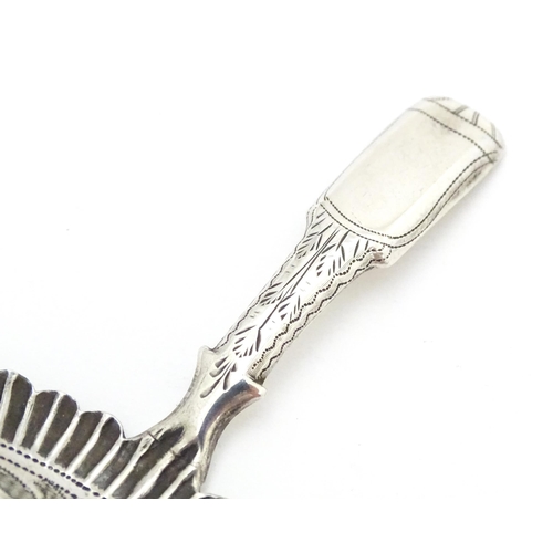 456 - A Geo IV silver caddy spoon with foliate decoration, hallmarked Birmingham 1829. Approx. 2 3/4