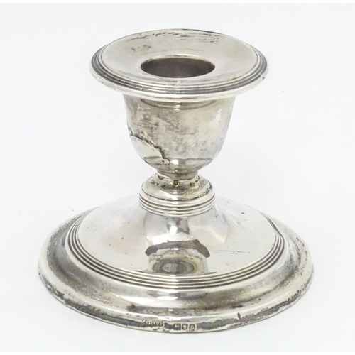 457 - A silver short candlestick hallmarked London 1912, maker Asprey & Co. Ltd. Approx. 3