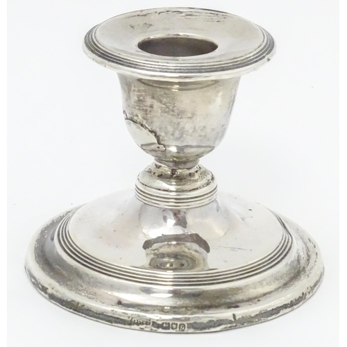 457 - A silver short candlestick hallmarked London 1912, maker Asprey & Co. Ltd. Approx. 3