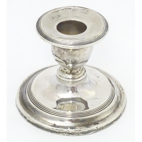 457 - A silver short candlestick hallmarked London 1912, maker Asprey & Co. Ltd. Approx. 3