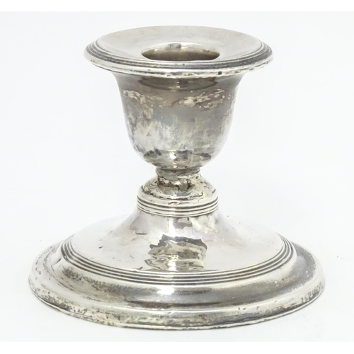 457 - A silver short candlestick hallmarked London 1912, maker Asprey & Co. Ltd. Approx. 3