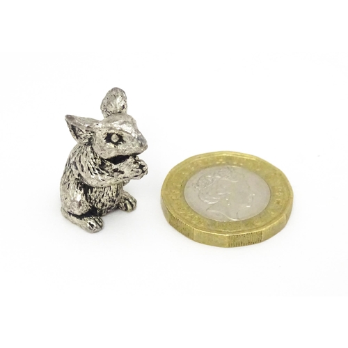 478 - A silver plate model of a seated mouse. Approx. 1