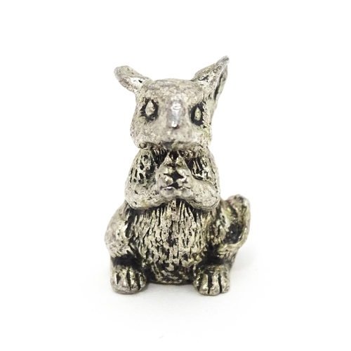 478 - A silver plate model of a seated mouse. Approx. 1