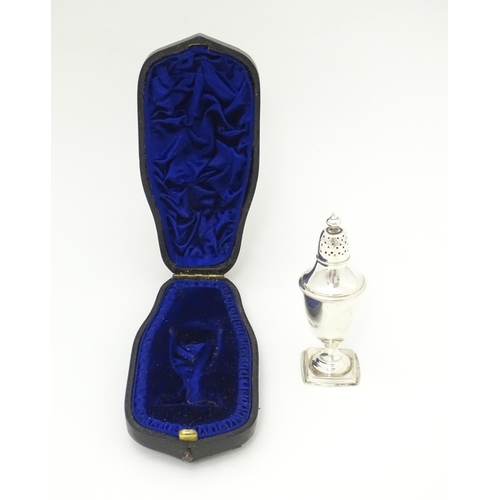 486 - A Victorian silver pepper hallmarked Sheffield 1890, maker Atkin Brothers. In a shaped fitted case. ... 