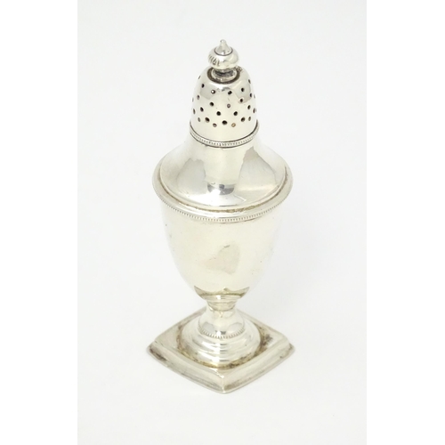 486 - A Victorian silver pepper hallmarked Sheffield 1890, maker Atkin Brothers. In a shaped fitted case. ... 