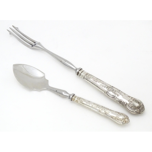 487 - A silver Kings pattern handled pickle fork. Together with a silver Kings pattern handled preserve sp... 