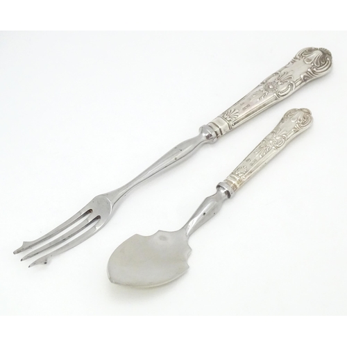 487 - A silver Kings pattern handled pickle fork. Together with a silver Kings pattern handled preserve sp... 