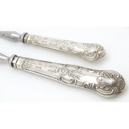 487 - A silver Kings pattern handled pickle fork. Together with a silver Kings pattern handled preserve sp... 