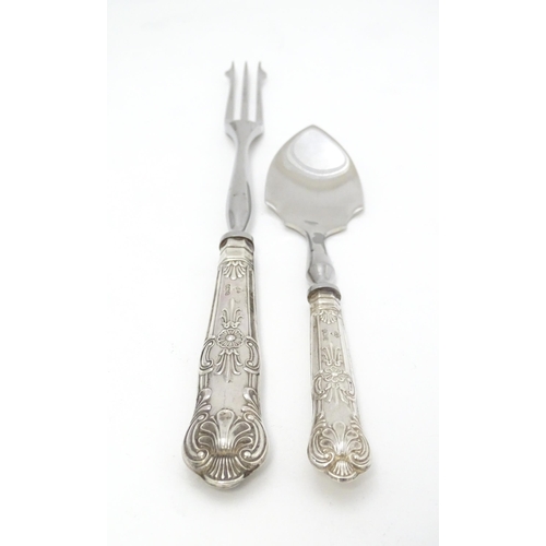 487 - A silver Kings pattern handled pickle fork. Together with a silver Kings pattern handled preserve sp... 