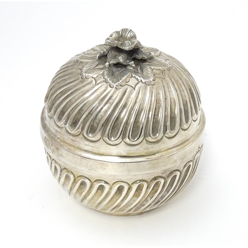 491 - A Continental .800 silver pot and cover with floral formed finial, opening to reveal a gilded interi... 