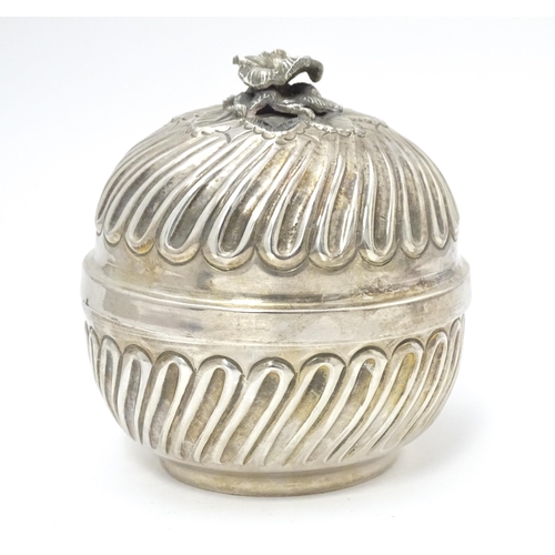 491 - A Continental .800 silver pot and cover with floral formed finial, opening to reveal a gilded interi... 