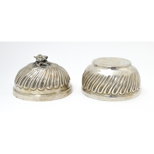 491 - A Continental .800 silver pot and cover with floral formed finial, opening to reveal a gilded interi... 