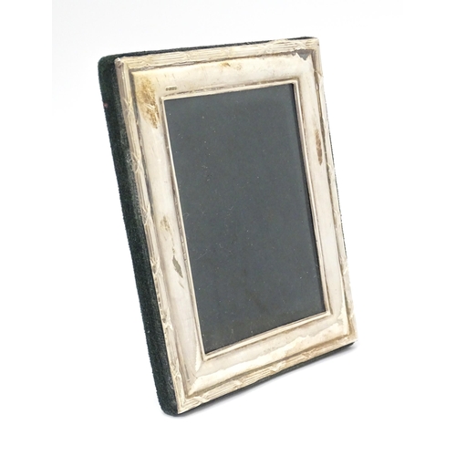 495 - A photograph frame with easel back and silver surround hallmarked Birmingham 1998 maker Ray Hall. Ap... 