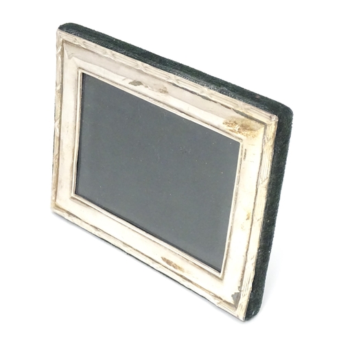 495 - A photograph frame with easel back and silver surround hallmarked Birmingham 1998 maker Ray Hall. Ap... 