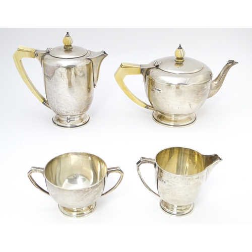 518 - An Art Deco silver four piece tea set hallmarked London 1934/35 with jubilee mark, maker Edward Barn... 